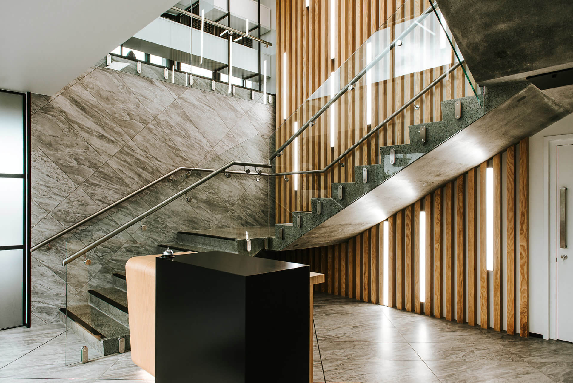 Reception station in timber veneer and lacquer.