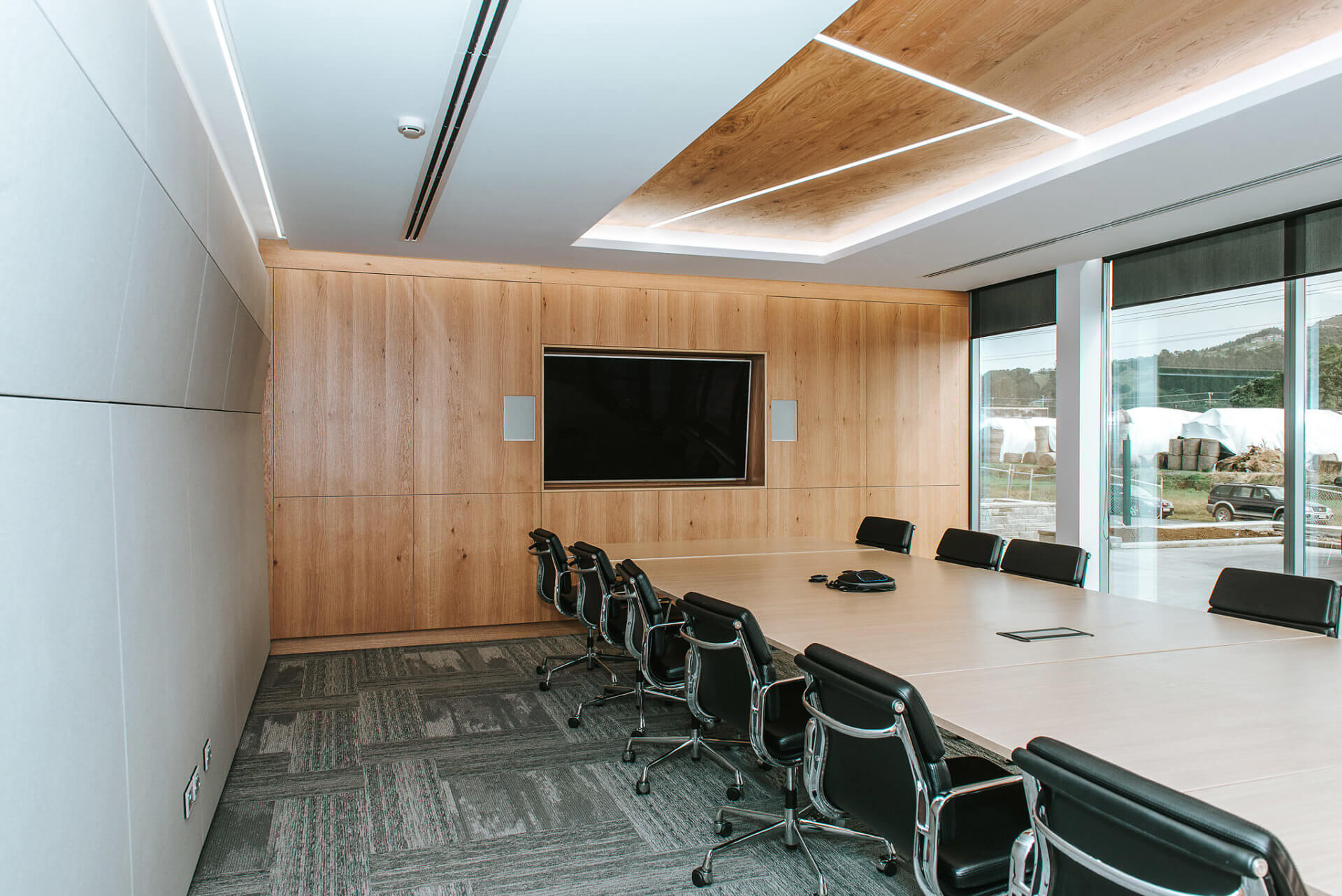 Board room audio wall in natural Oak veneer.